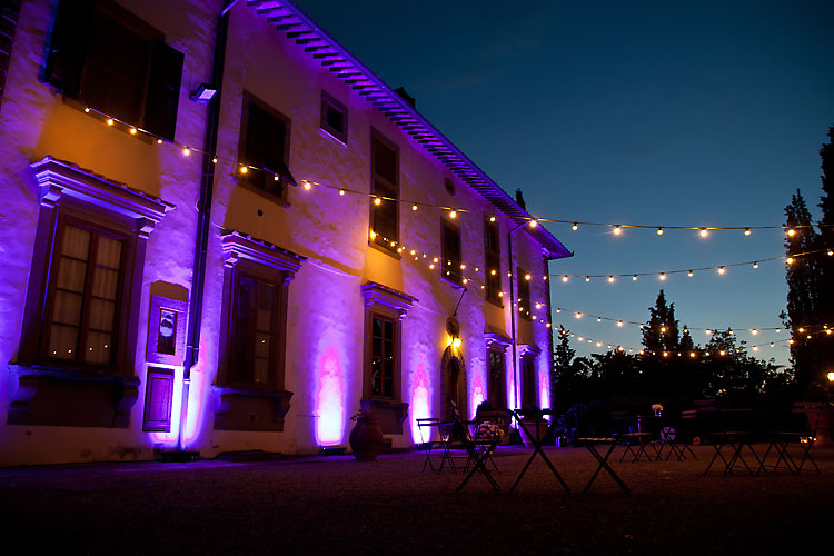 Cafe lights at wedding reception at Castello Vicchiomaggio Italy Destination Wedding