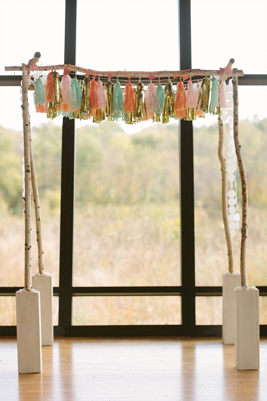 Wedding chuppah with paper tassels and garlands