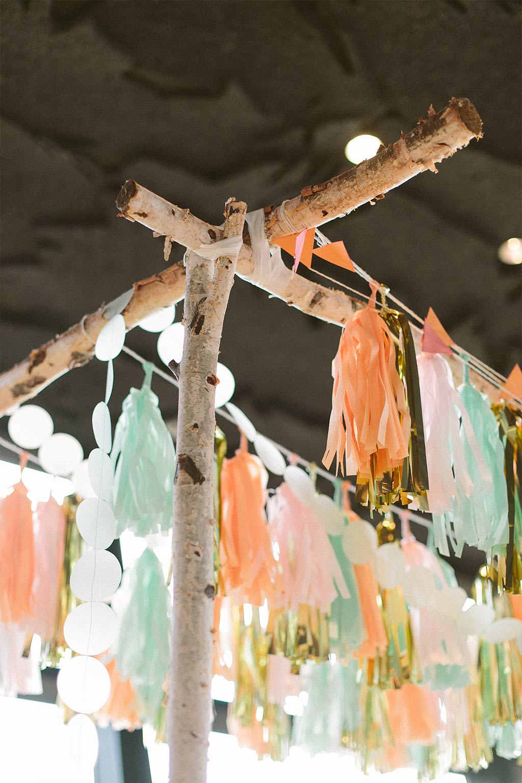 Wedding chuppah detail with paper tassels and garlands