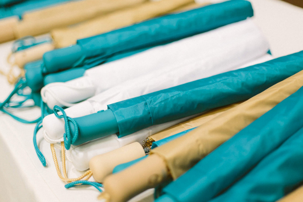 Teal and biege wedding umbrellas