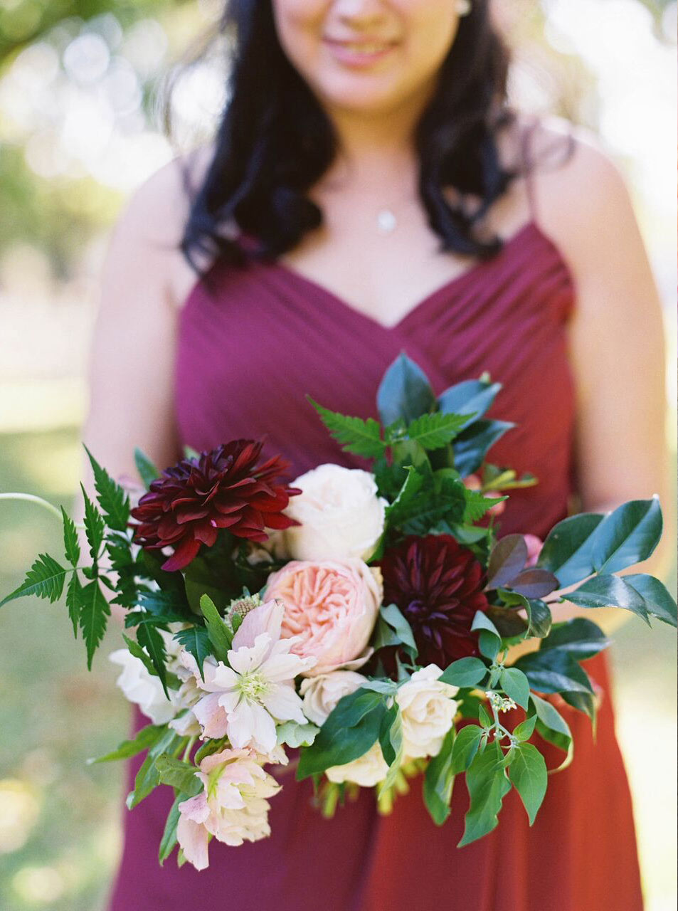 Bridesmaid bouquet peach and dark plum with chiffon dress