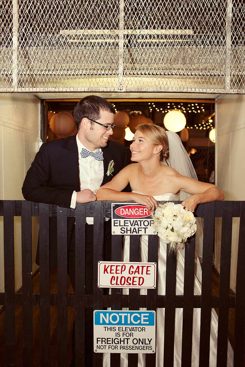 Bride and Groom on 1920s elevator shaft at Hickory Street Annex Wedding in Dallas