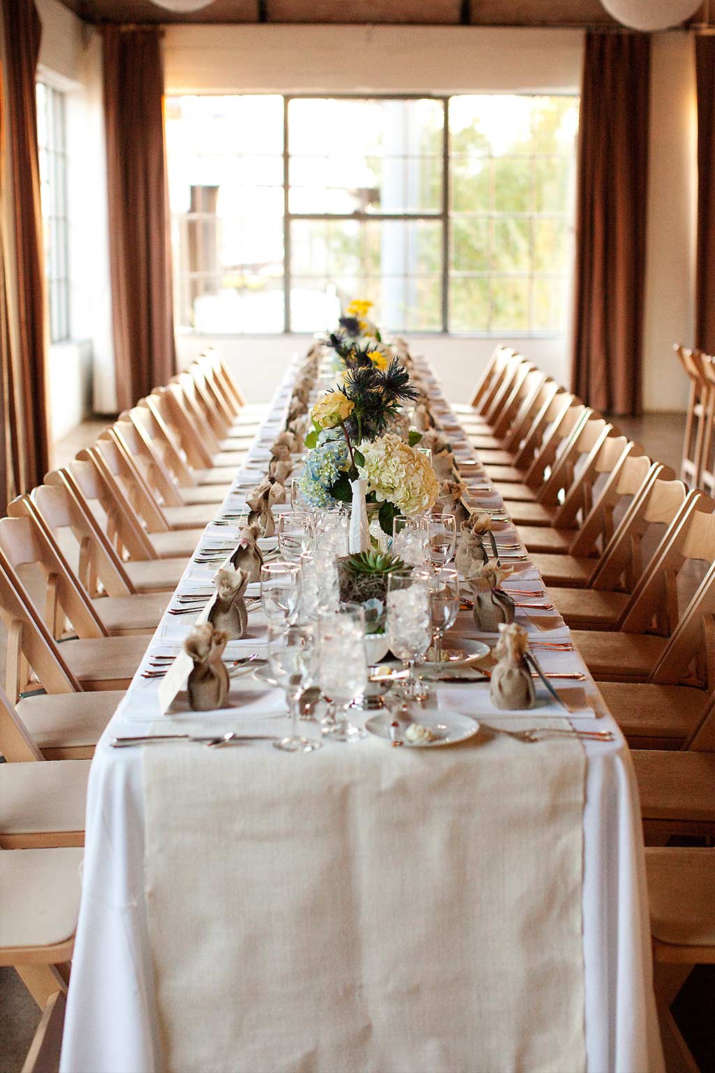 long head table at wedding reception at Hickory Street Annex in dallas