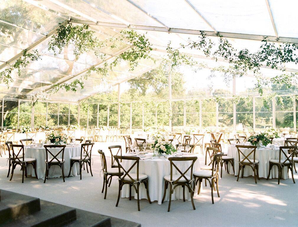 Arlington Hall wedding reception clear tent off back patio with carpeting and cross back chairs