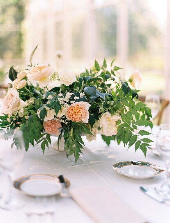 Peach and white low lush wedding centerpiece