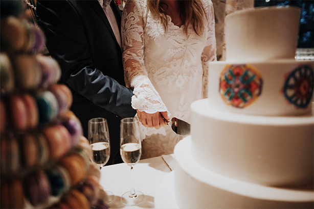 Bride and groom cut the wedding cake