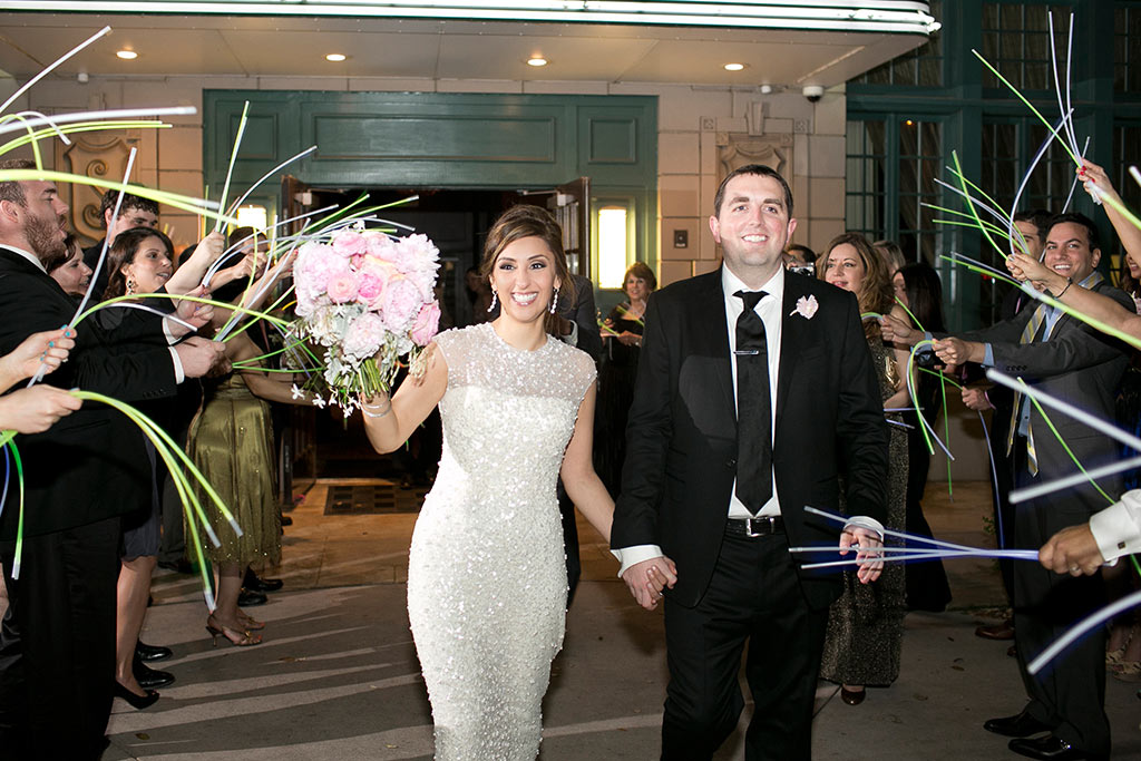 Bride and groom wedding grand exit with glow wands