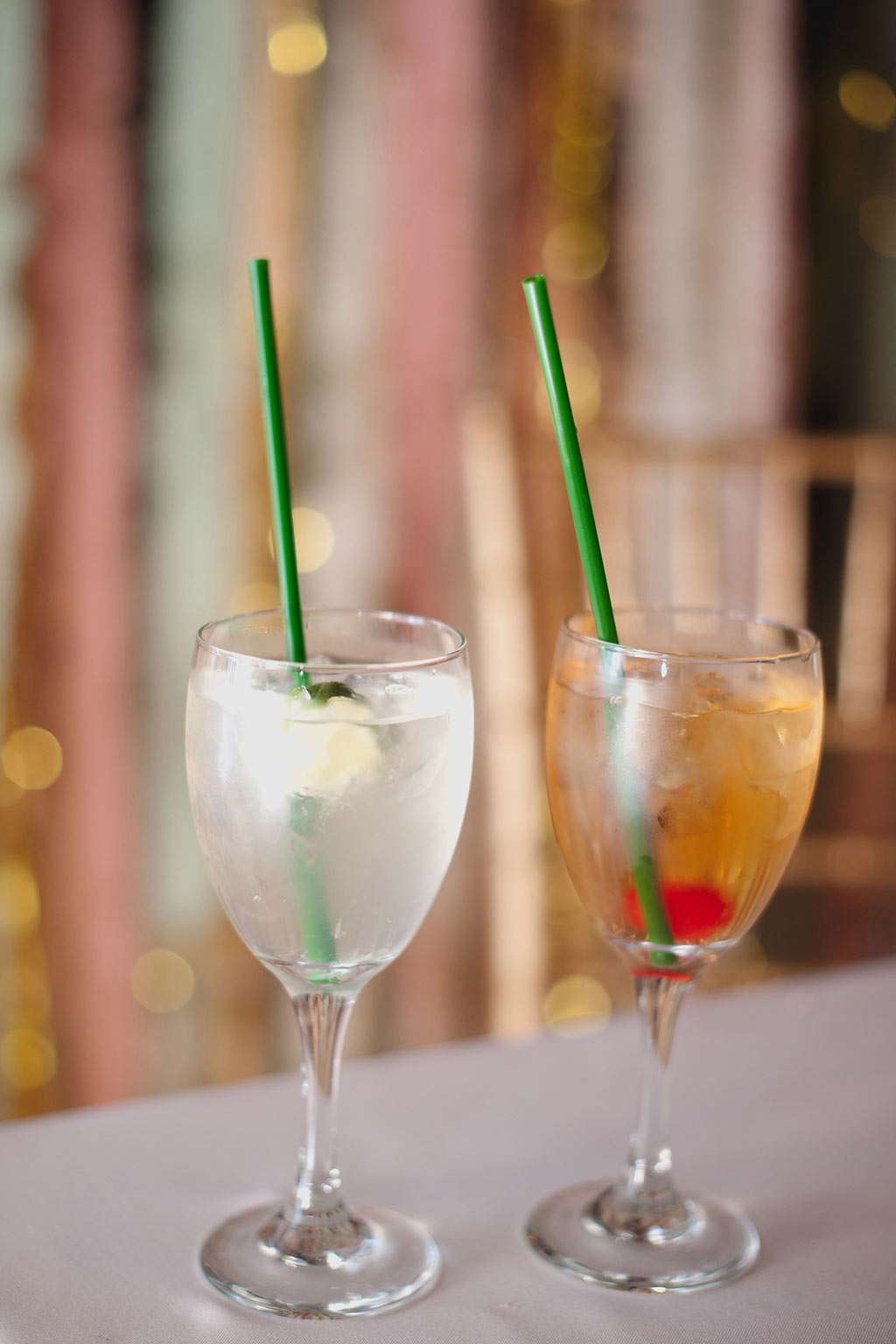 Wedding his and her cocktails with green straws